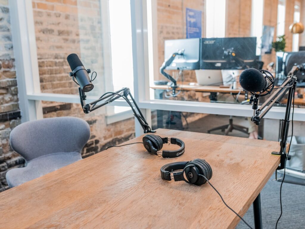 Professional podcast studio setup with microphones and headphones ready for recording